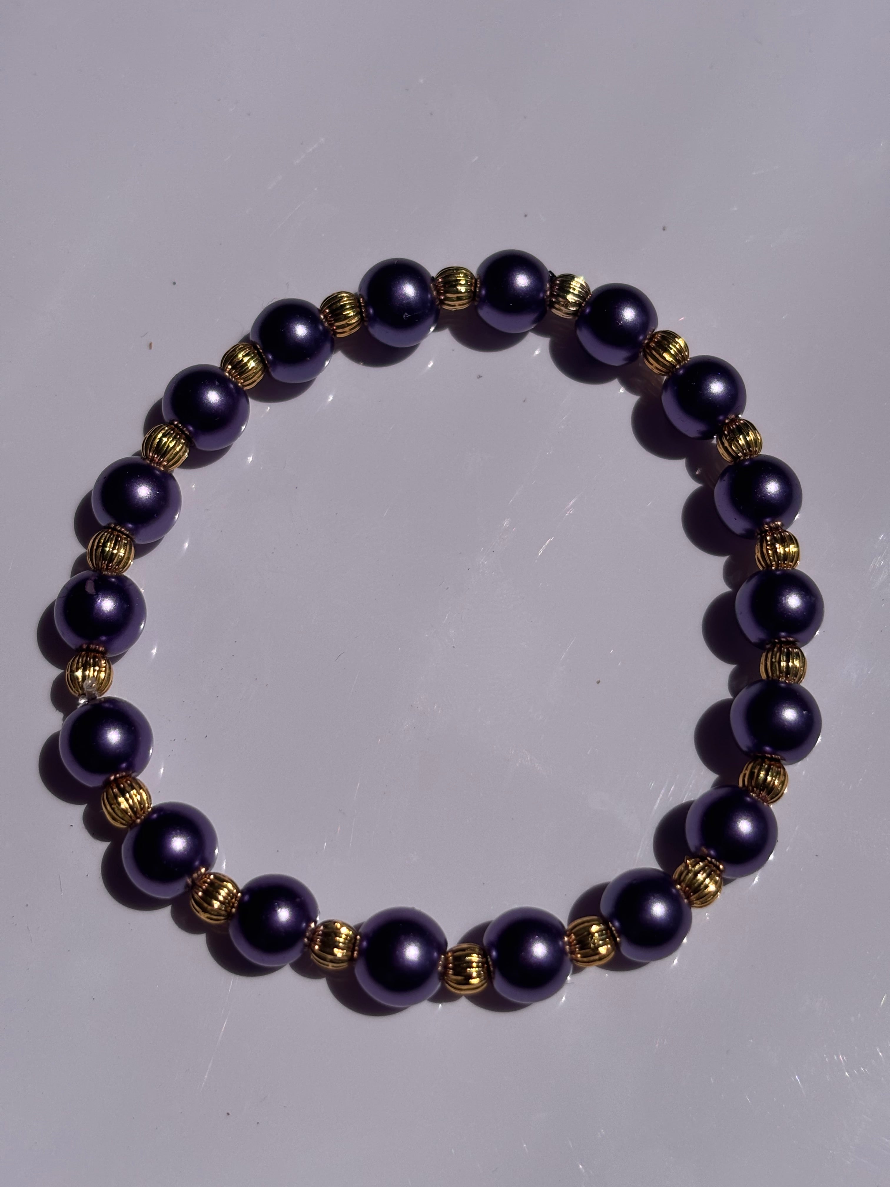 Purple 6mm pearl colored bracelet