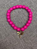 Magenta beaded dragon fly bracelet