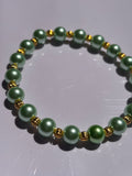 Light green pearl colored 6mm beaded bracelet