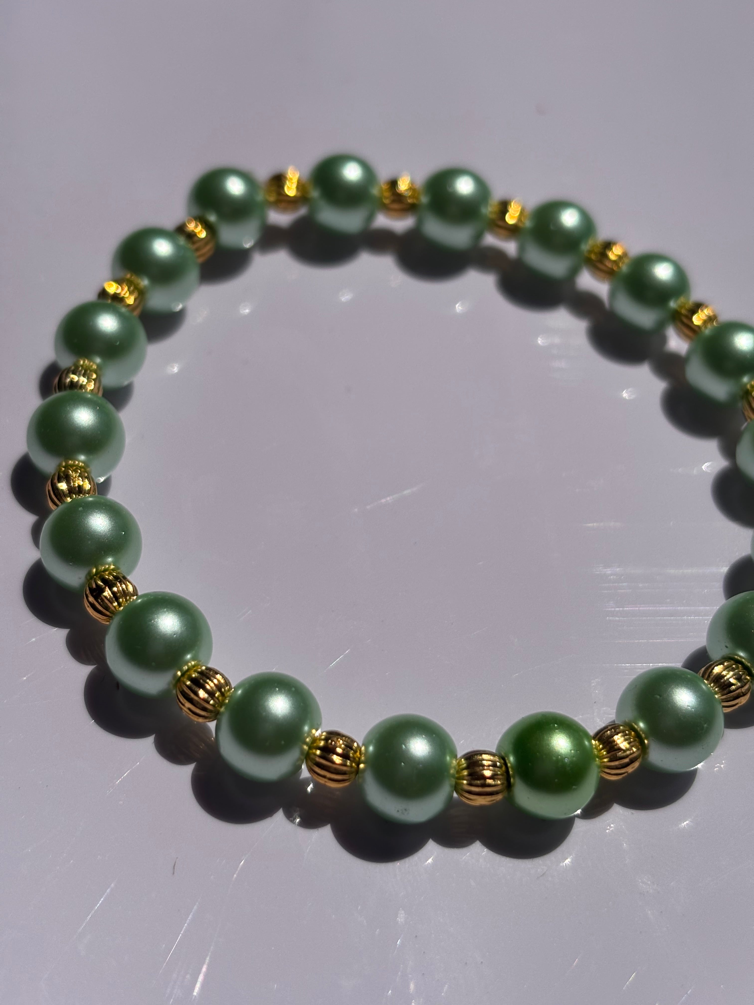 Light green pearl colored 6mm beaded bracelet